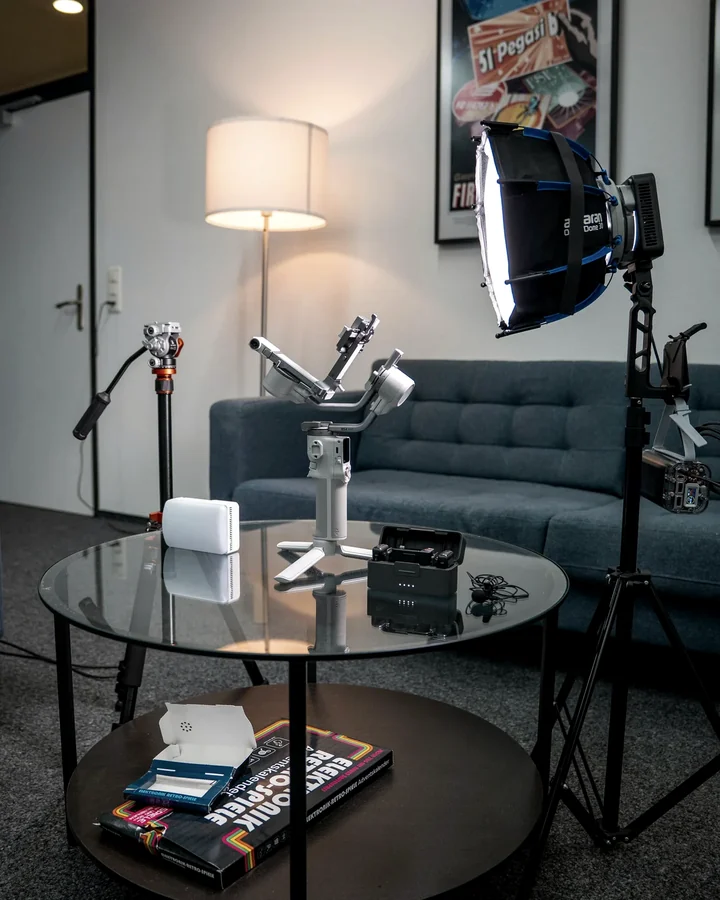 A content production setup with camera equipment and studio lighting